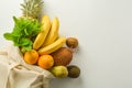 Grocery shopping with eco bag over white background. Zero waste and plastic free concept. Flat lay, top view. Copy space Royalty Free Stock Photo