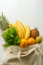 Grocery shopping with eco bag over white background. Zero waste and plastic free concept. Flat lay, top view. Copy space Royalty Free Stock Photo