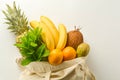 Grocery shopping with eco bag over white background. Zero waste and plastic free concept. Flat lay, top view. Copy space Royalty Free Stock Photo