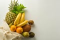 Grocery shopping with eco bag over white background. Zero waste and plastic free concept. Flat lay, top view. Copy space Royalty Free Stock Photo