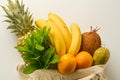 Grocery shopping with eco bag over white background. Zero waste and plastic free concept. Flat lay, top view. Copy space Royalty Free Stock Photo