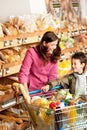 Grocery shopping store - Woman with child Royalty Free Stock Photo