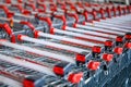 The grocery shopping trolleys stacked. Lots of empty carts in the supermarket Royalty Free Stock Photo