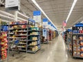 A grocery store aisle at a Walmart Store with no people