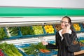 Grocery store - Business woman with mobile phone Royalty Free Stock Photo