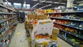 Grocery Store Chain filed for Bankruptcy. Clutter, scattered goods on dirty floor in supermarket. Mess, huge pile of cardboard