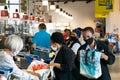 Grocery Store check-out staff and customers wearing face masks during flu pandemic Royalty Free Stock Photo