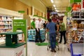 Grocery store employees handing out rationed bottles of water