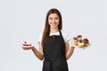 Grocery store employees, small business and coffee shops concept. Friendly smiling waitress in cafe holding plates with