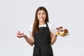 Grocery store employees, small business and coffee shops concept. Friendly smiling waitress in cafe holding plates with