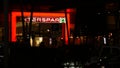 Grocery store with glowing Interspar logo sign. Shopping. Grocery supermarket