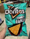 Grocery store hand holding Doritos tangy ranch chips in a bag Royalty Free Stock Photo