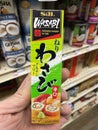Grocery store hand holding Wasabi paste