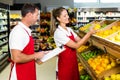 Grocery store staff with clipboard Royalty Free Stock Photo