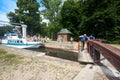 Grodno - August 2021: Dombrovka lock workers open dam and gate manually for Neman boat passage on Augustow Canal