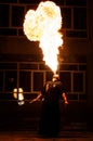 Grodno, Belarus - April, 30, 2012 fire show, fire blowing performance, dancing with flame, male master fakir with fire works on st