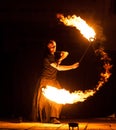 Grodno, Belarus - April, 30, 2012 fire show, dancing with flame, male master fakir juggler with fire works on street arts festival