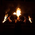 Grodno, Belarus - April, 30, 2012 fire show, fire blowing performance, dancing with flame, male master fakir with fire works on st