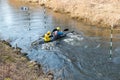 GRODNO, BELARUS - APRIL, 2019: kayak freestyle competition on fast cold water river strenuously rowing, spirit of victory