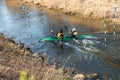 GRODNO, BELARUS - APRIL, 2019: kayak freestyle competition on fast cold water river strenuously rowing, spirit of victory