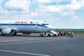 GRODNO, BELARUS - AUGUST 2019: crowd of tourists near the plane awaiting flight. Aircraft that await passengers Royalty Free Stock Photo