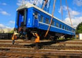 GRODNO, BELARUS - AUGUST 01, 2013. Workers move the car to the rails