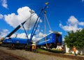 GRODNO, BELARUS - AUGUST 01, 2013. Workers move the car to the rails