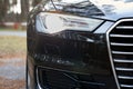 GRODNO, BELARUS - DECEMBER 2019: Audi A6 4G C7 Luxury Black car parts right front xenon luminous headlight and fog light