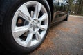 GRODNO, BELARUS - DECEMBER 2019: Audi A6 4G C7 Luxury car closeup alloy wheel with Dunlop winter tires side view with