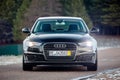GRODNO, BELARUS - DECEMBER 2019: Audi A6 4G, C7 2.0 TDI 190 Hp 2016 black metallic front view outdoors on winter empty