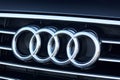 GRODNO, BELARUS - DECEMBER 2019: Audi logo and badge on car grill. Closeup of chromium plated metal logotype on dark