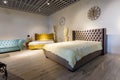 GRODNO, BELARUS - DECEMBER 2018: big double bed in chester style for elite loft interior in expensive store showroom of furniture