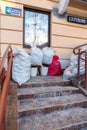 Grodno, Belarus, February 25, 2022: New arrival of clothes in a second-hand store. Old used clothes in large plastic bags.