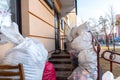 Grodno, Belarus, February 25, 2022: New arrival of clothes in a second-hand store. Old used clothes in large plastic bags. Royalty Free Stock Photo