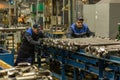 Grodno, Belarus - February 15, 2023: Workers work in the workshop for the production of cardan drives on Open Joint Stock Company