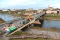 Grodno, Belarus, January 18, 2022: Employees of the road service in special yellow vests perform work on the repair of the roadway