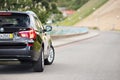 GRODNO, BELARUS - JUNE 2020: BMW X3 II F25 2.0i xDrive rear outdoors on sunny road background of summer city promenade Royalty Free Stock Photo