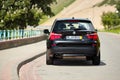 GRODNO, BELARUS - JUNE 2020: BMW X3 II F25 2.0i xDrive selective focus back view with wheels turned outdoors on sunny Royalty Free Stock Photo
