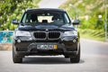 GRODNO, BELARUS - JUNE 2020: BMW X3 II F25 2.0i xDrive selective focus front view outdoors on sunny road background of Royalty Free Stock Photo