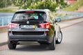 GRODNO, BELARUS - JUNE 2020: BMW X3 II F25 2.0i xDrive selective focus three fourth upper back view with wheels turned Royalty Free Stock Photo