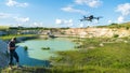 Grodno, Belarus June 11, 2022: A drone DJI MAVIC 3 explores an old abandoned quarry. Aerial photography of an industrial facility