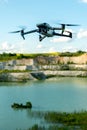 Grodno, Belarus June 11, 2022: A drone DJI MAVIC 3 explores an old abandoned quarry. Aerial photography of an industrial facility