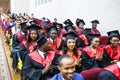 GRODNO, BELARUS - JUNE, 2018: Foreign african medical students in square academic graduation caps and black raincoats during Royalty Free Stock Photo