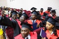 GRODNO, BELARUS - JUNE, 2018: Foreign african medical students in square academic graduation caps and black raincoats during Royalty Free Stock Photo