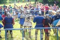 GRODNO, BELARUS - JUNE 2019: group of medieval jousting knight fight, in armor, helmets, chain mail with axes and swords on lists