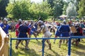 GRODNO, BELARUS - JUNE 2019: group of medieval jousting knight fight, in armor, helmets, chain mail with axes and swords on lists