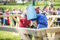 GRODNO, BELARUS - JUNE 2019: medieval jousting knight fight, in armor, helmets, chain mail with axes and swords on lists. historic