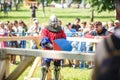 GRODNO, BELARUS - JUNE 2019: medieval jousting knight fight, in armor, helmets, chain mail with axes and swords on lists. historic