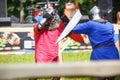 GRODNO, BELARUS - JUNE 2019: medieval jousting knight fight, in armor, helmets, chain mail with axes and swords on lists. historic