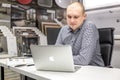 GRODNO, BELARUS - MARCH 2019: young man employees works at the computer in modern luxury plumbing store